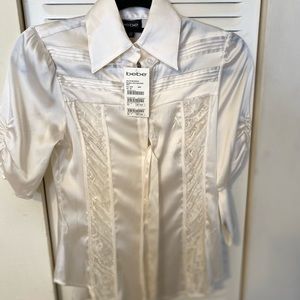 BeBe off-white satin laced blouse with belt. NTW.